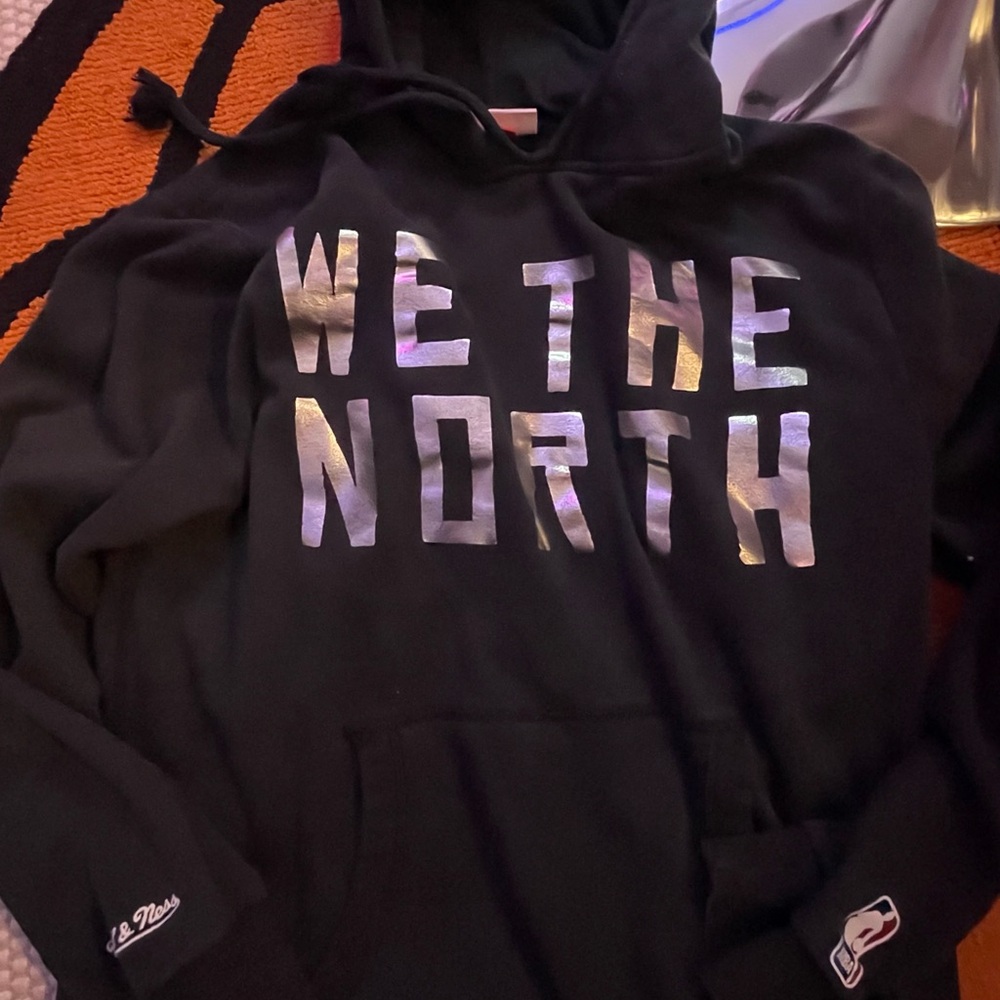 Mitchell & Ness Toronto Raptors “We The North” Black Hoodie with Silver Details
